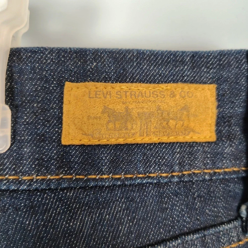 Levis 542 Flare Jeans Women 22M Dark Wash Blue Denim Distressed Hem Mid Rise y2k